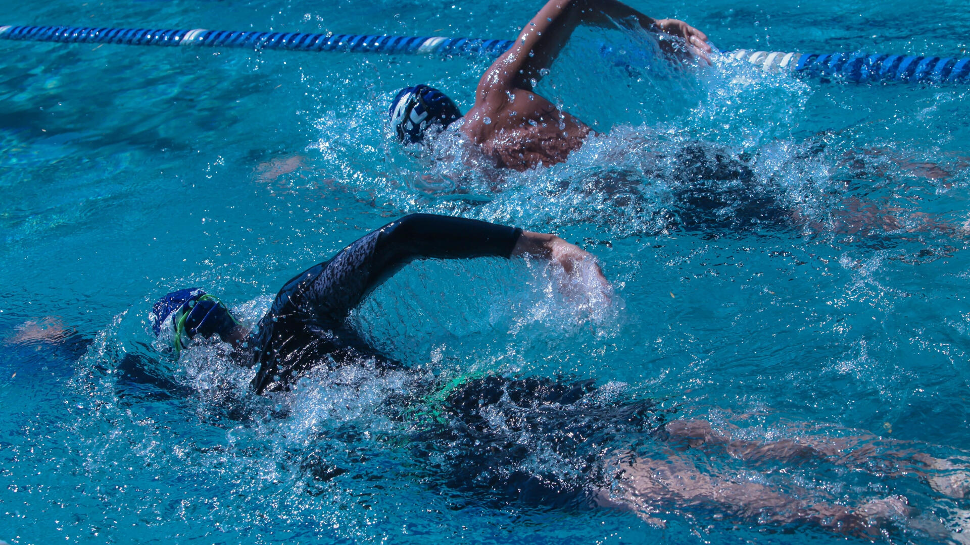 Swimmers swimming coaching lessons